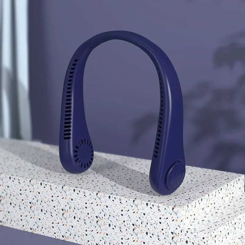 White bladeless neck fan being worn showing hands-free design and USB charging port