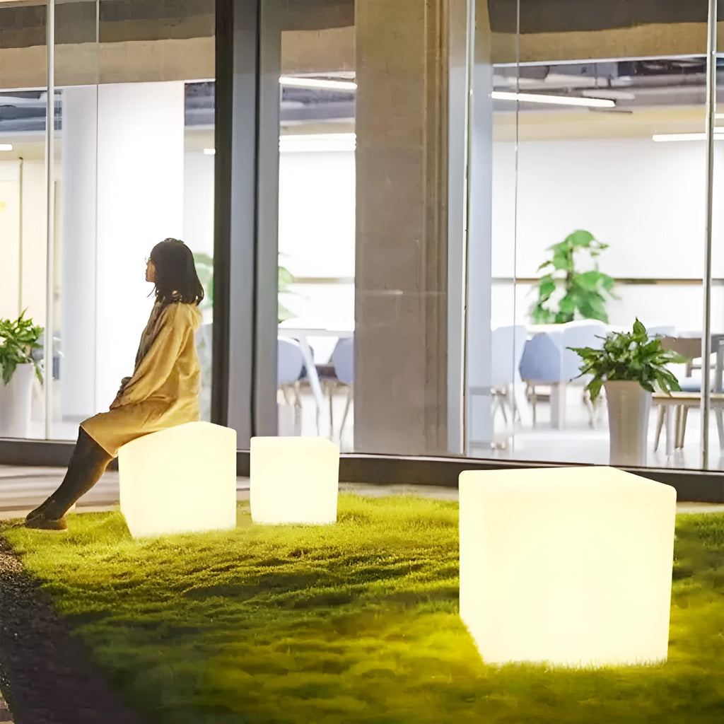 Modern square LED cube light stool in outdoor setting showing waterproof IP65 design