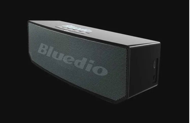 BS-6 black compact rectangular Bluetooth smart speaker on a surface.