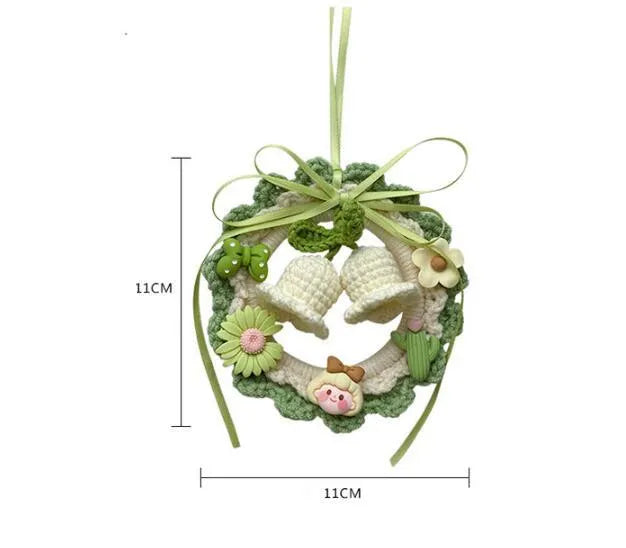 Woven wool bell orchid car pendant hanging display showing colour options including green, pink, purple and yellow variations