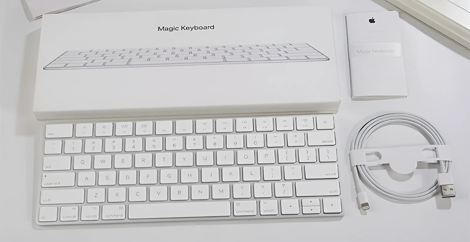 White Apple Bluetooth keyboard with ultra-thin metal design and multimedia function keys
