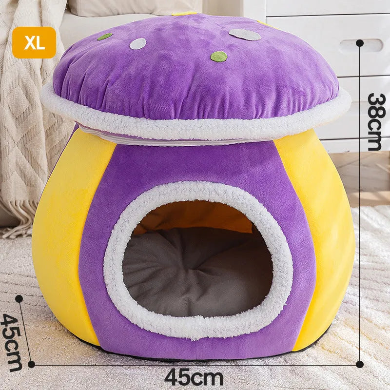 Purple mushroom-shaped plush cat nest with a detachable blanket, shown on a wooden floor.