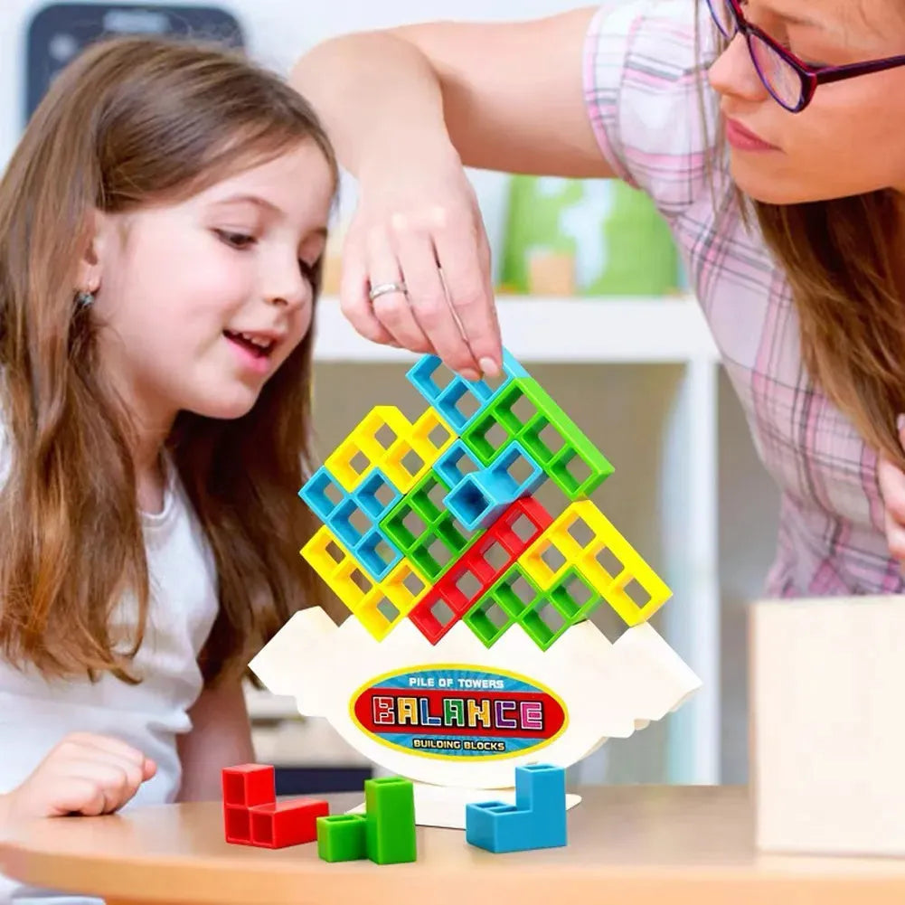 Plastic balance stacking game with 16 coloured building blocks on a chassis