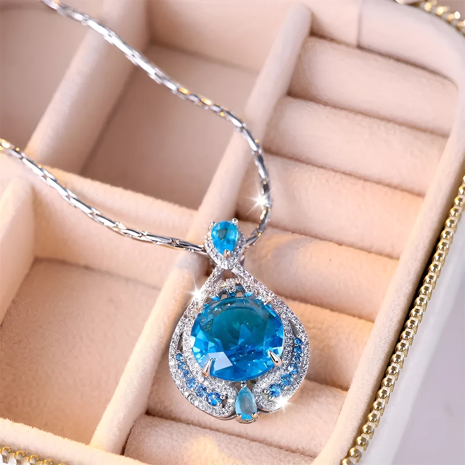 Women's bright blue crystal necklace with geometric fireworks-cut pendant on water wave chain