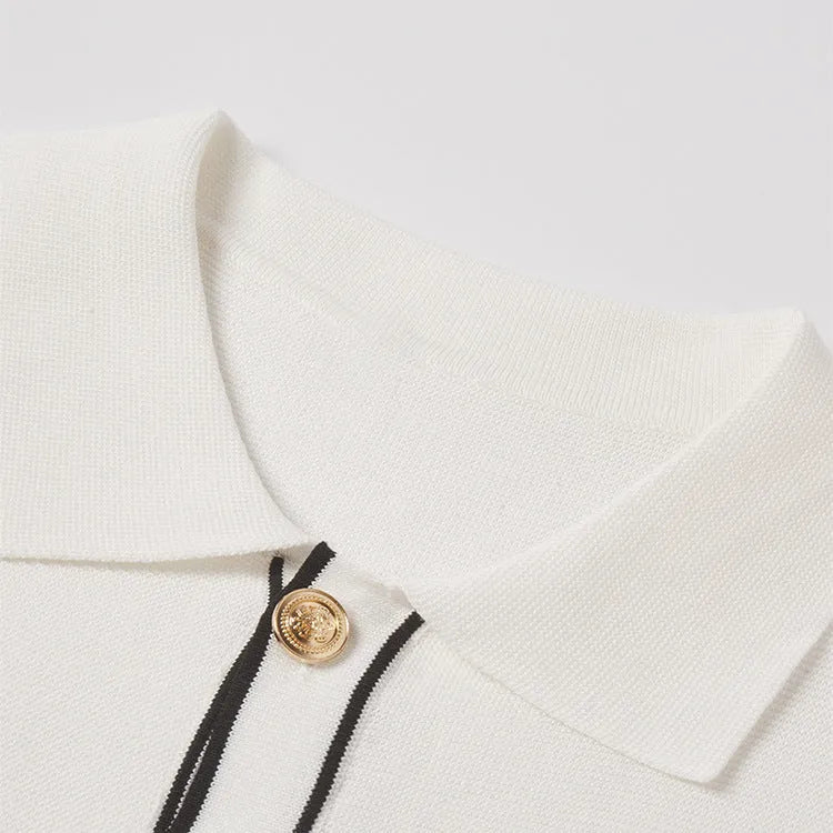 White women's short sleeve cardigan with dark contrast lapels laid flat