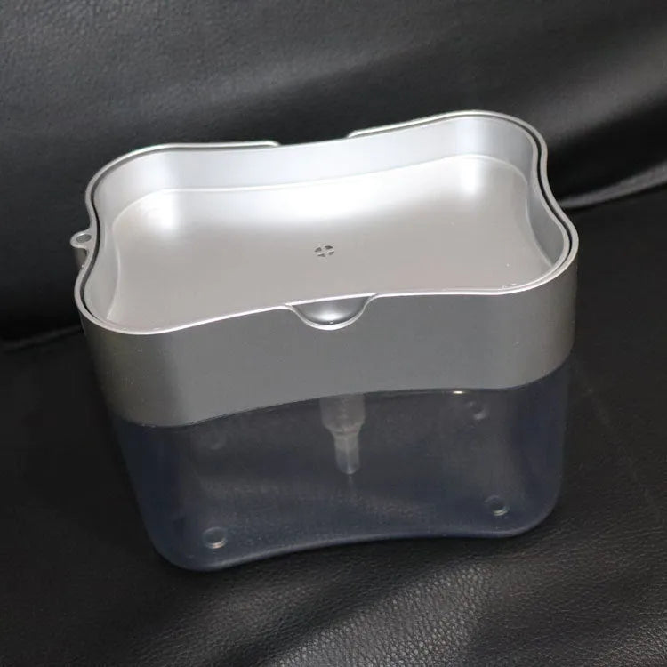 Plastic kitchen soap dispenser in silver with pump top on countertop