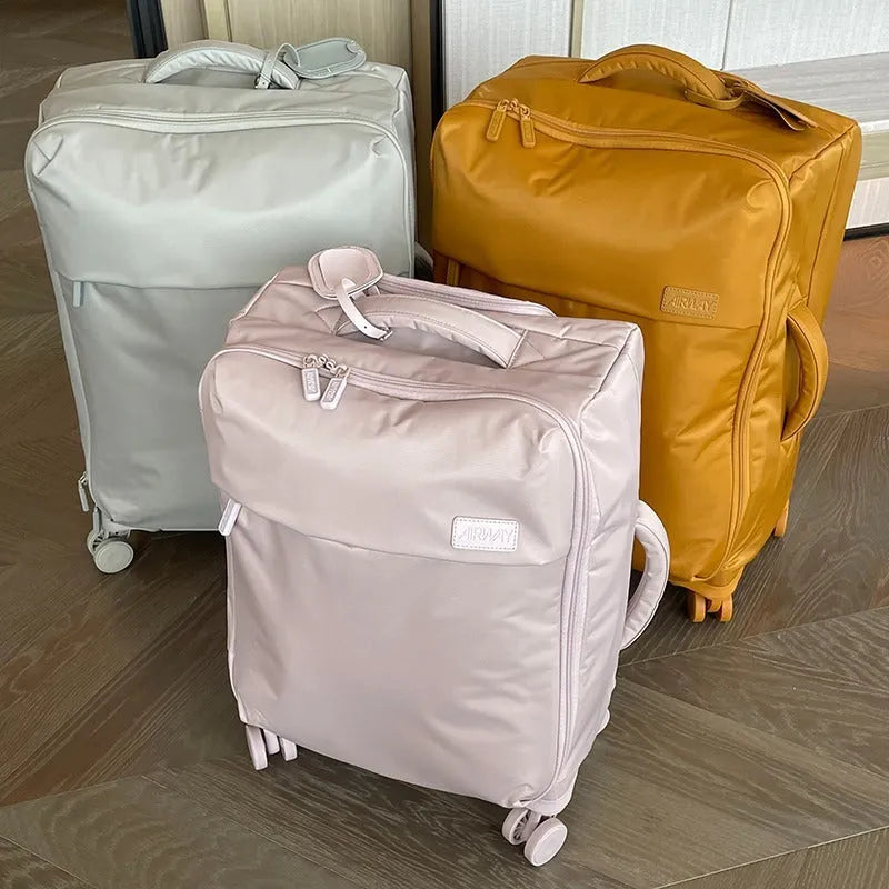 Ultra-light waterproof Oxford cloth suitcase in bluestone green with universal wheels