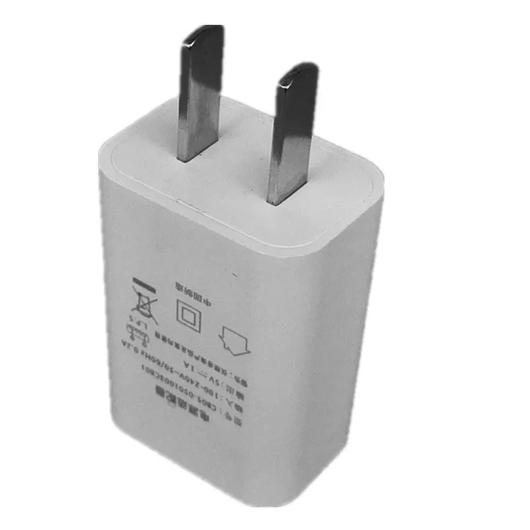 Slim white 5V 1A USB wall charger with CE and FCC marks on label.