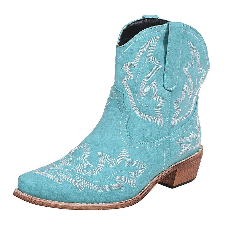 Women's blue embroidered cowboy ankle boots with a low wedge heel and pointed toe.