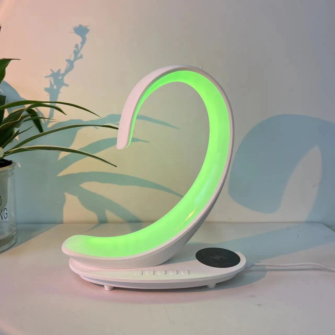 White swan decorative lamp with wireless charging pad and Bluetooth speaker featuring colourful LED lights