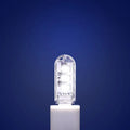Small white LED night light with USB cable showing compact 6cm bedside design