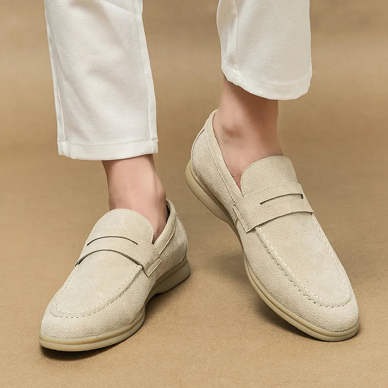 Men's black leather slip-on casual shoes with a round toe and mid-height heel on a rubber sole.