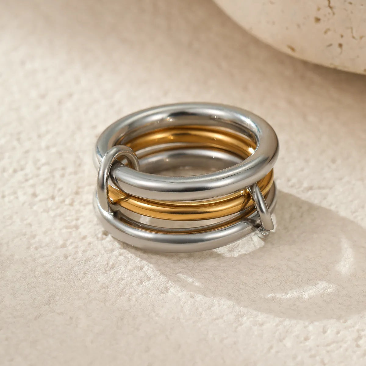 Gold plated stainless steel stacked ring set for women in an exaggerated design.