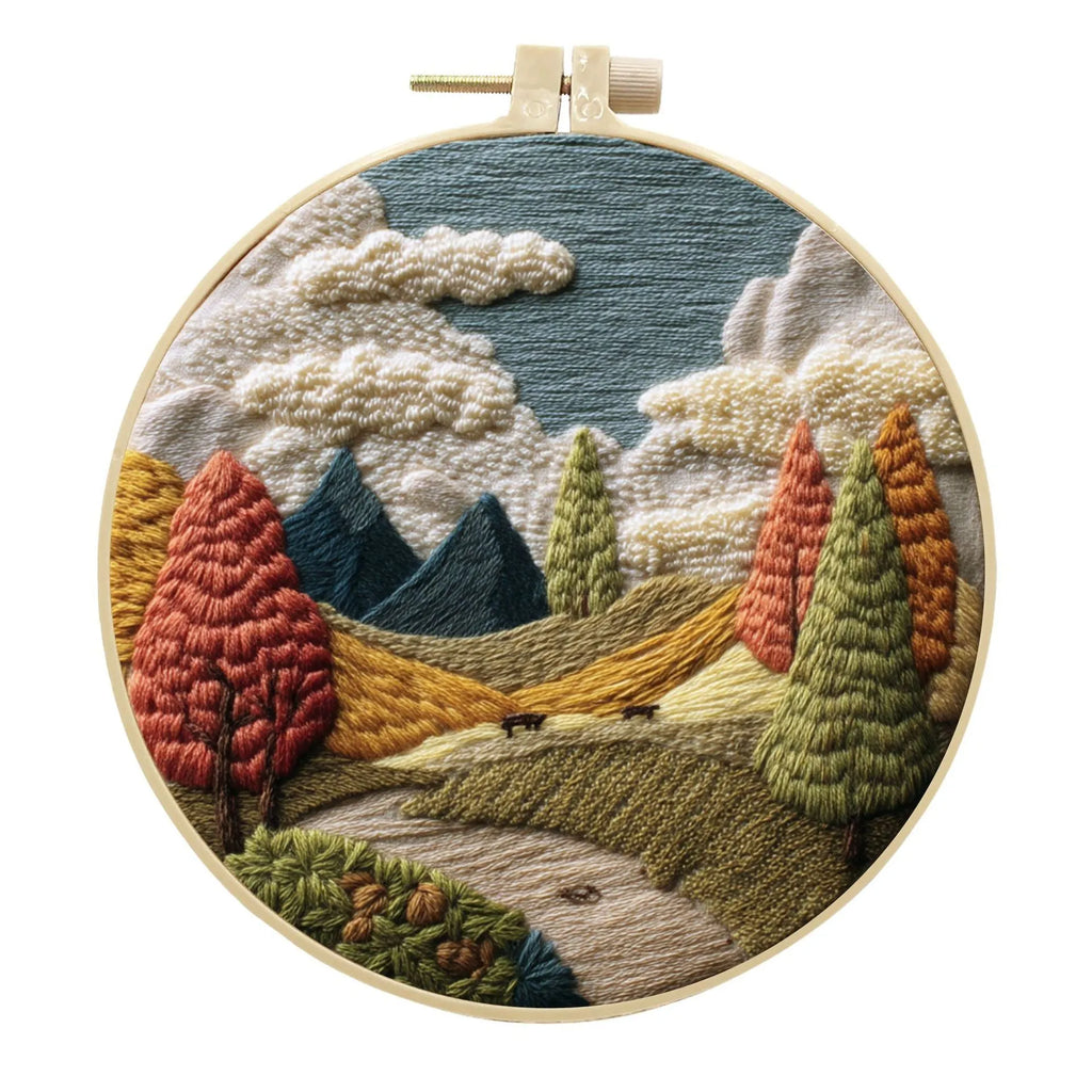 Embroidery DIY landscape kit with cotton fabric, bamboo frame, scissors, and thread for scenic designs