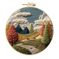 Embroidery DIY landscape kit with cotton fabric, bamboo frame, scissors, and thread for scenic designs
