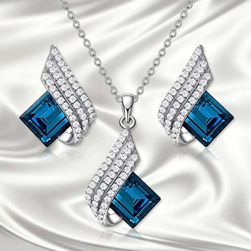 Women's electroplated necklace and earring set with cross chain design and glass pendant