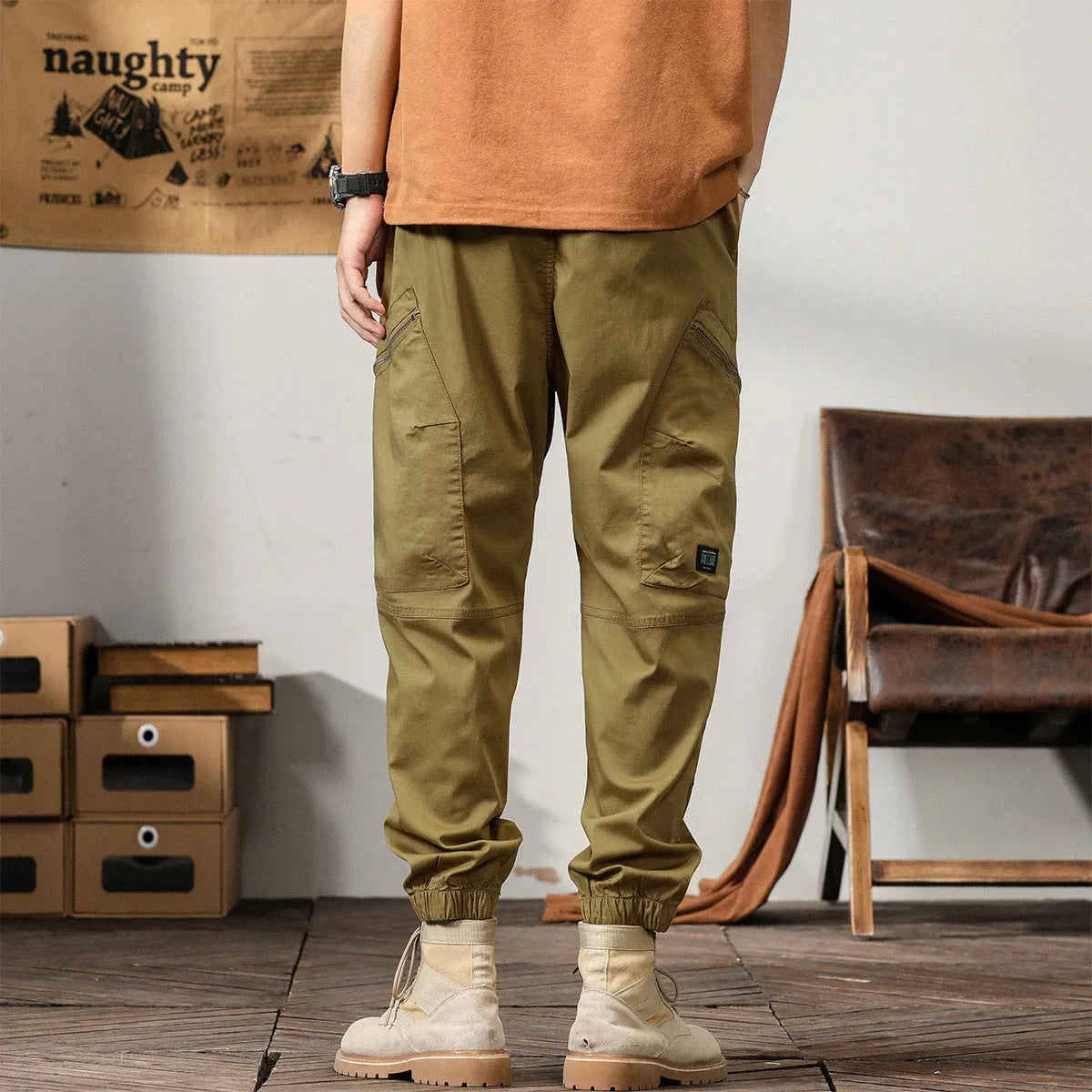 Men's cotton harem pants with ankle banded legs in khaki colour showing zip placket fly detail