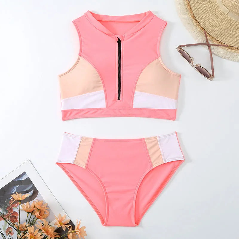Pink high waist bikini swimsuit with side splits and briefs style on a mannequin