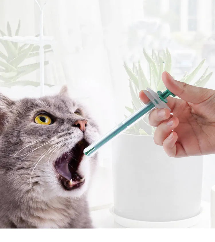 Two pet pill shooter guns with soft silicone tips for administering tablets to cats and dogs