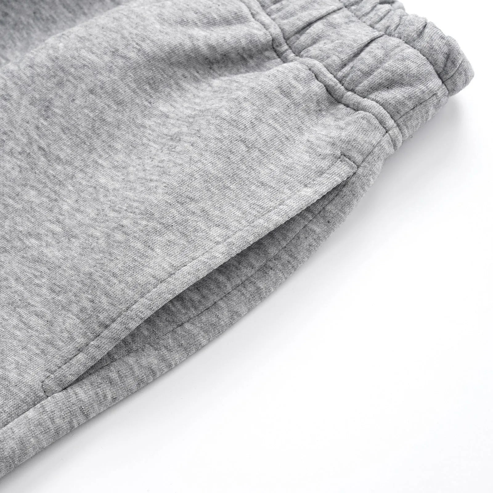 Men's grey cotton trousers with straight wide-leg fit on hanger
