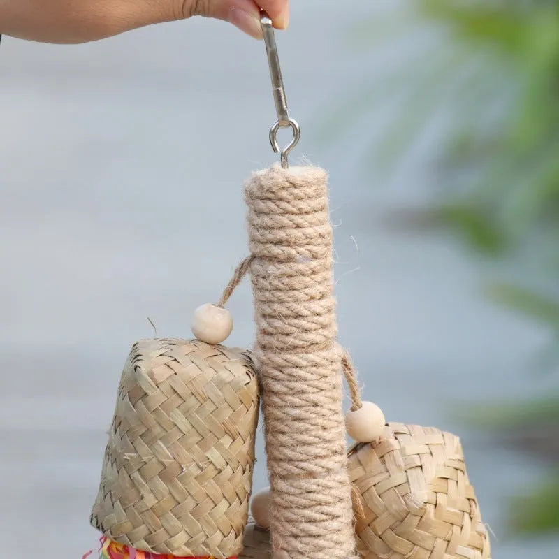 Wood and sisal rope parrot toy with colourful shredded paper strands for foraging.