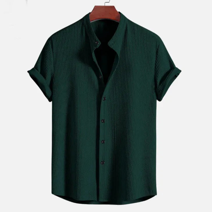 Men's loose fit short sleeve polyester shirt in multiple colours on a size chart background.