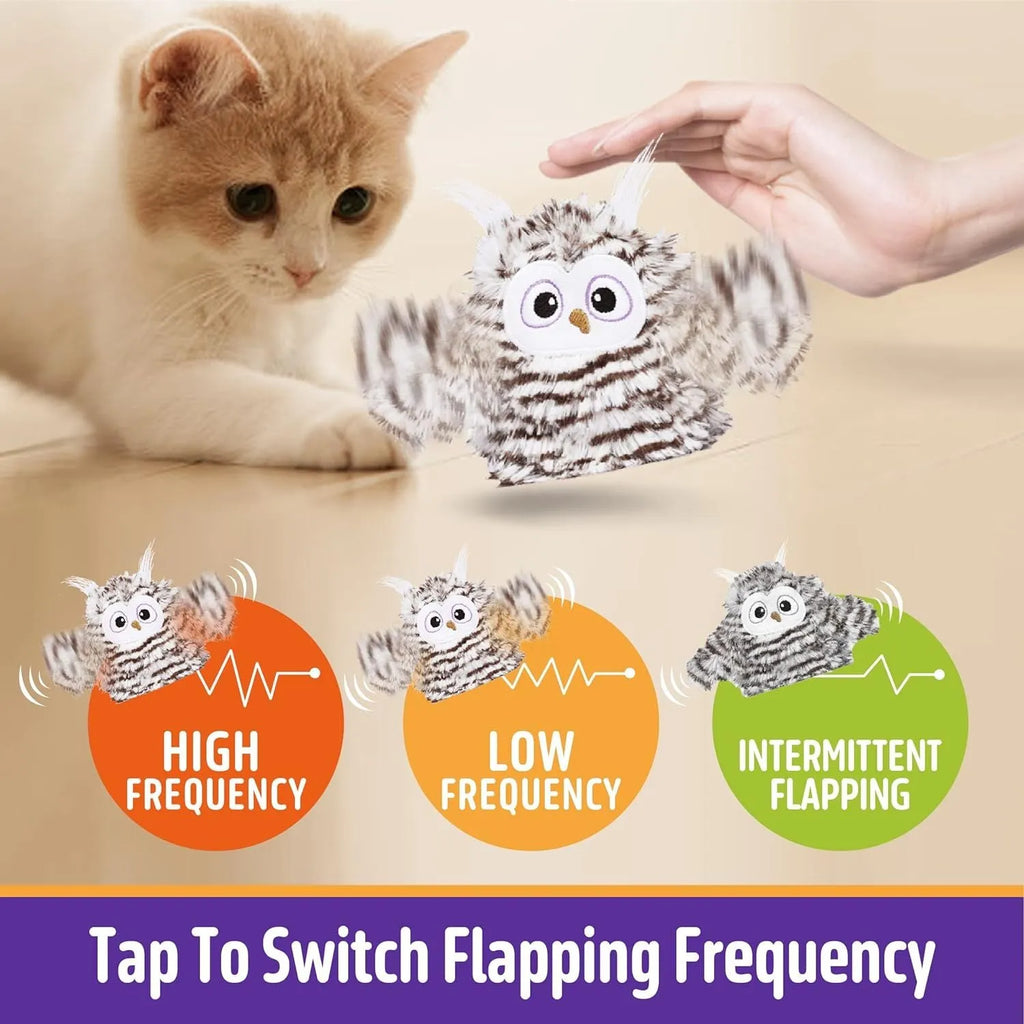 Grey rechargeable electronic owl cat toy with flapping wings on a floor.