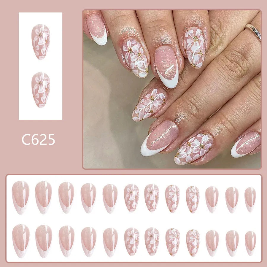 Short glossy almond false nails with French style and glitter powder flower design