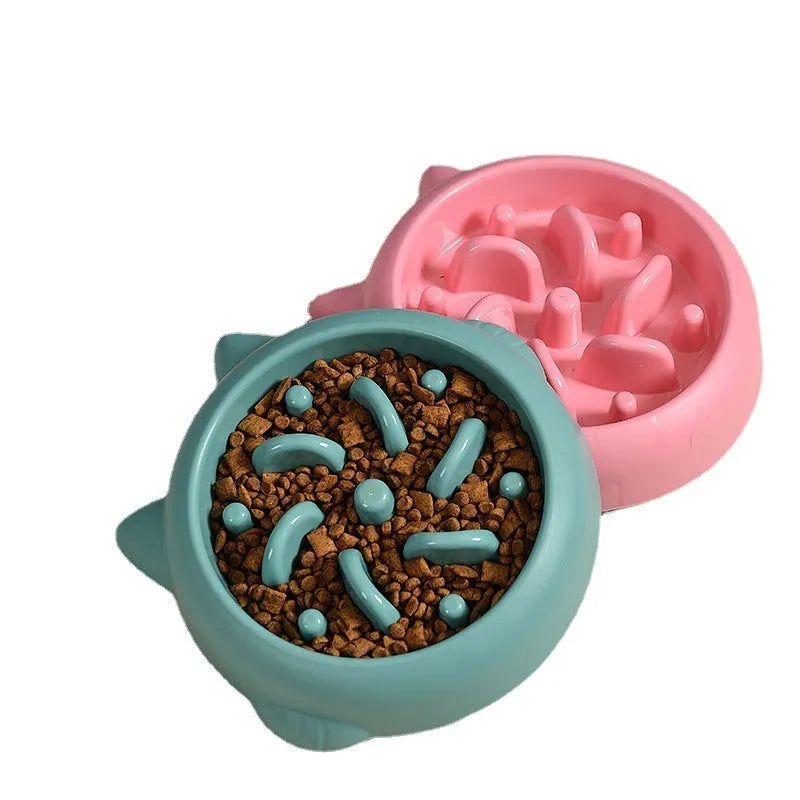 Green pet slow feeder bowl with raised internal ridges to slow eating for dogs and cats.