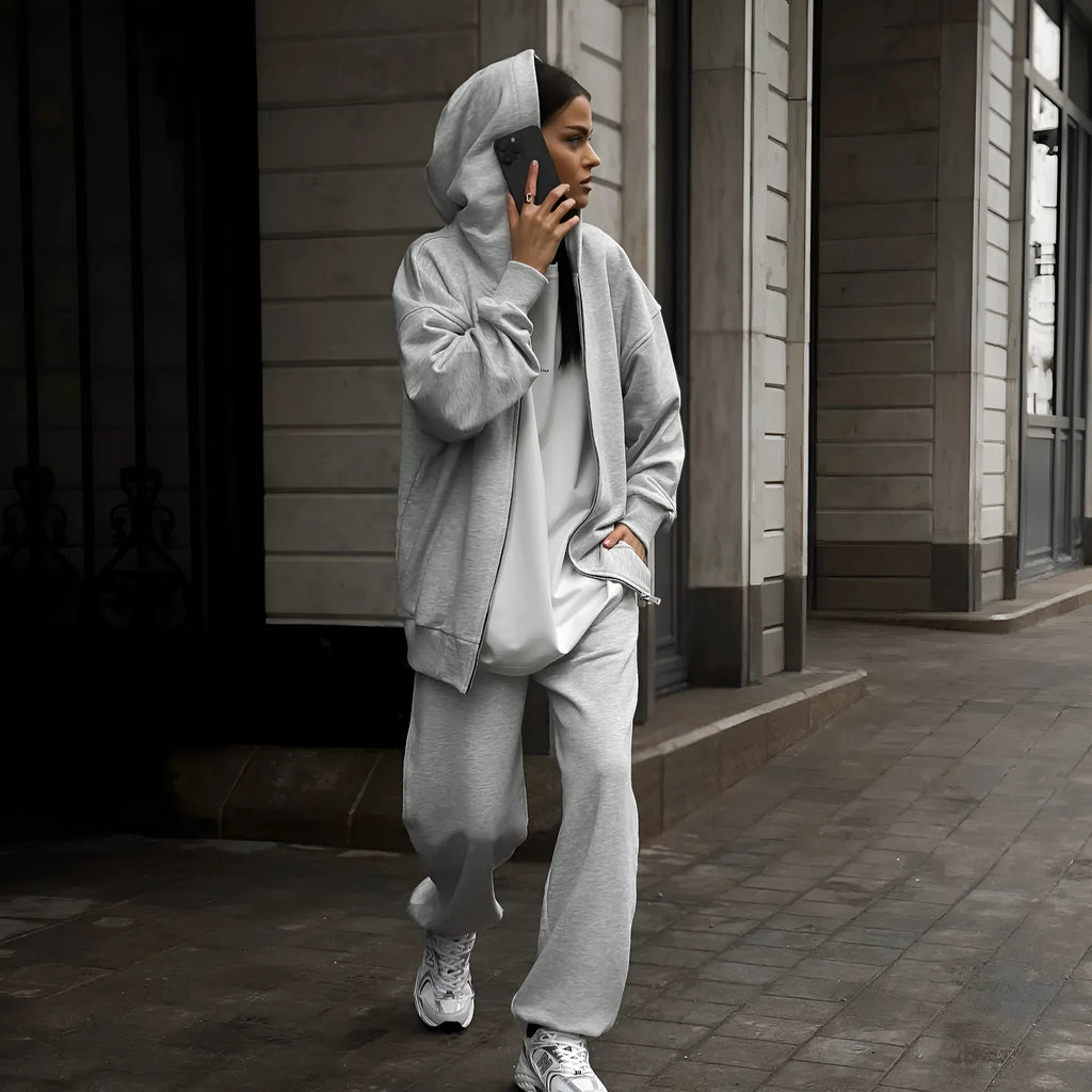 Red loose fit street style coat and trousers two-piece set on a hanger.