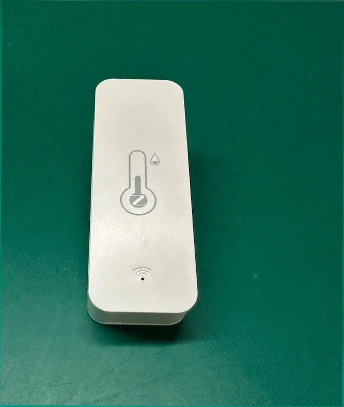 White WiFi temperature and humidity sensor with LCD display showing readings, compact rectangular ABS housing