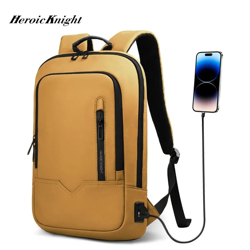 Lightweight black polyester laptop backpack with USB charging port shown next to a 14-inch laptop.