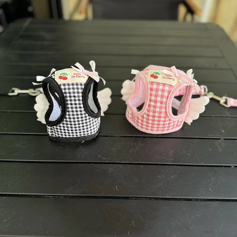 Pink and black cotton chest and back dog harness with hand holding rope in sizes XS to 2XL.
