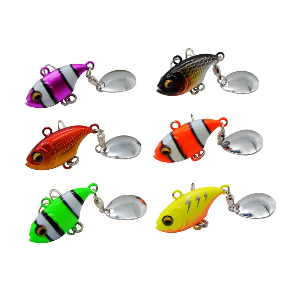 Metal iron plate fishing lure with rotating sequins in zebra stripe orange colour pattern.
