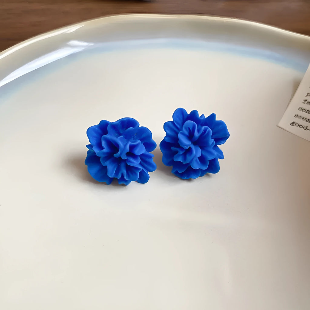 Geometric women's earrings with cloth construction and silver needle-blue resin flower accents
