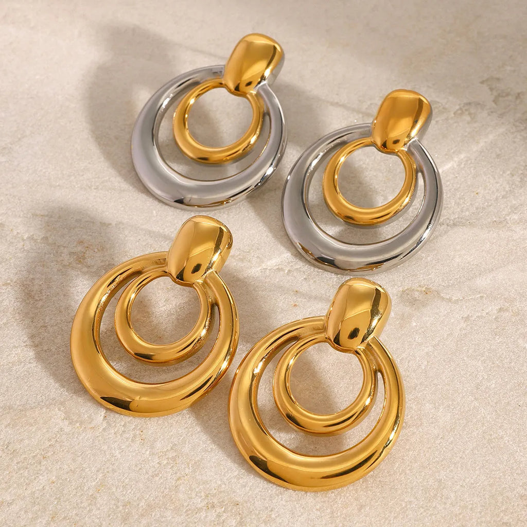 Golden round geometric double-layer hollow stud earrings with 18K gold electroplating on titanium steel
