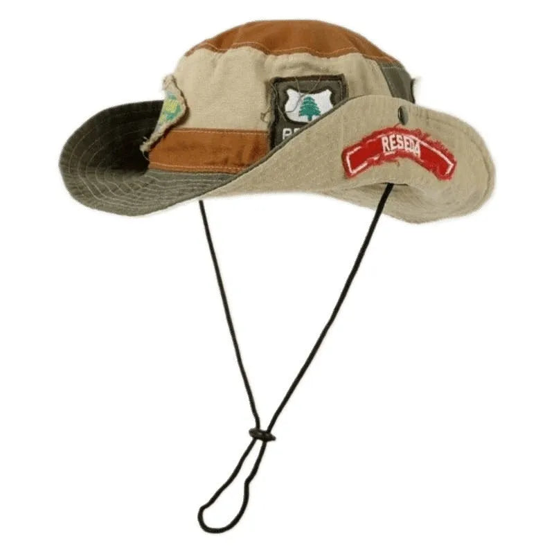 Army green cotton fisherman hat with patchwork design and flat top crown, folded to show storage feature