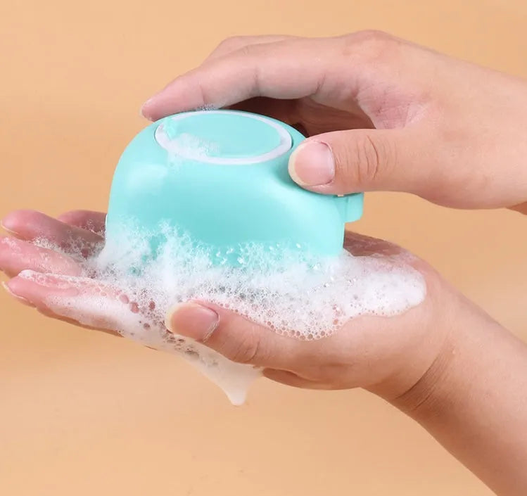 Blue silicone dog bath and massage brush for grooming