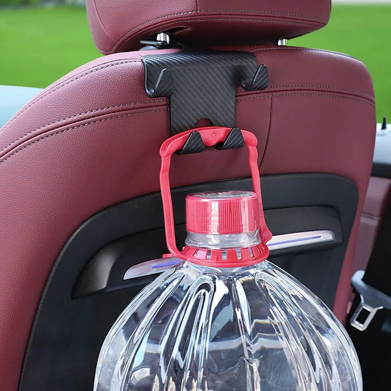 Black ABS plastic car hook with an integrated mobile phone holder bracket for rear seat organisation.
