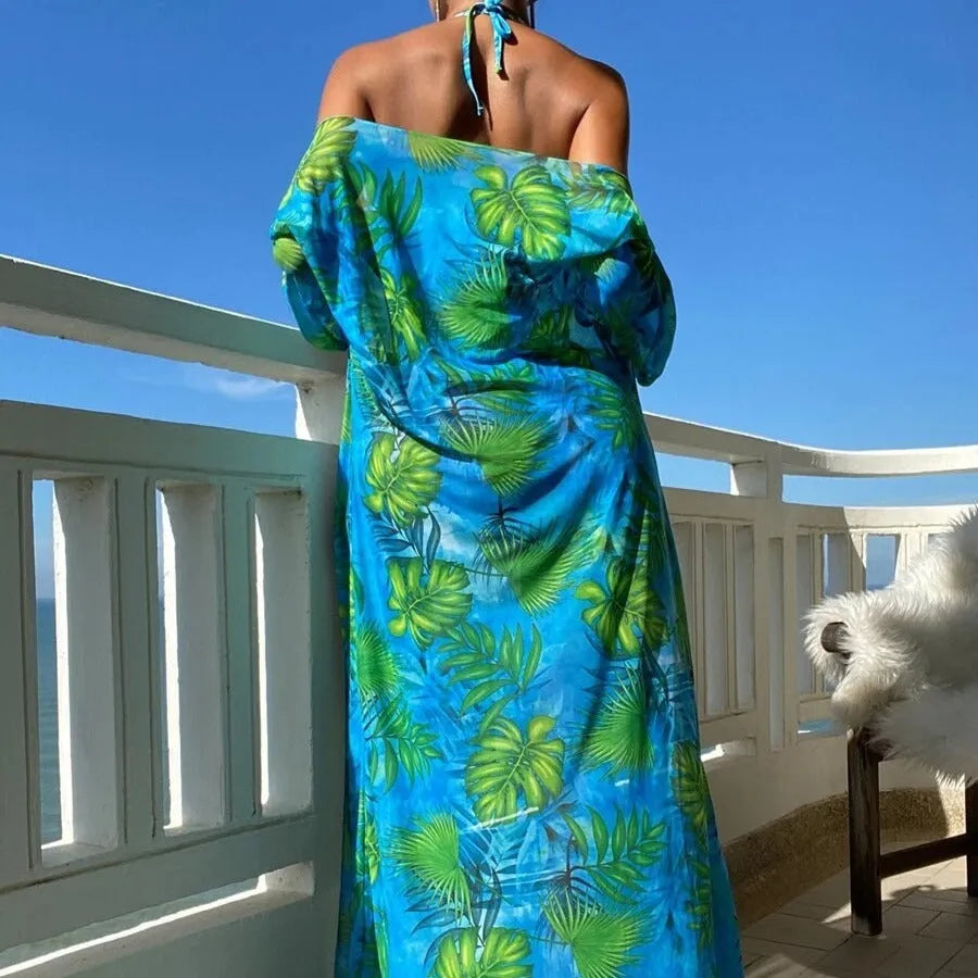 Women's floral pattern bikini set with long sleeve cover-up and banded briefs on a mannequin