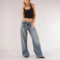 Women's blue loose straight wide-leg cotton mop trousers with low waist on a hanger