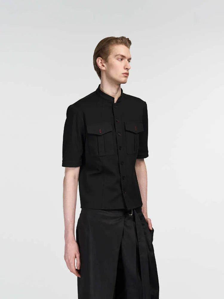 Handmade black half-sleeve hunting shirt with red eye camouflage pattern, showing shirt collar and button placket.