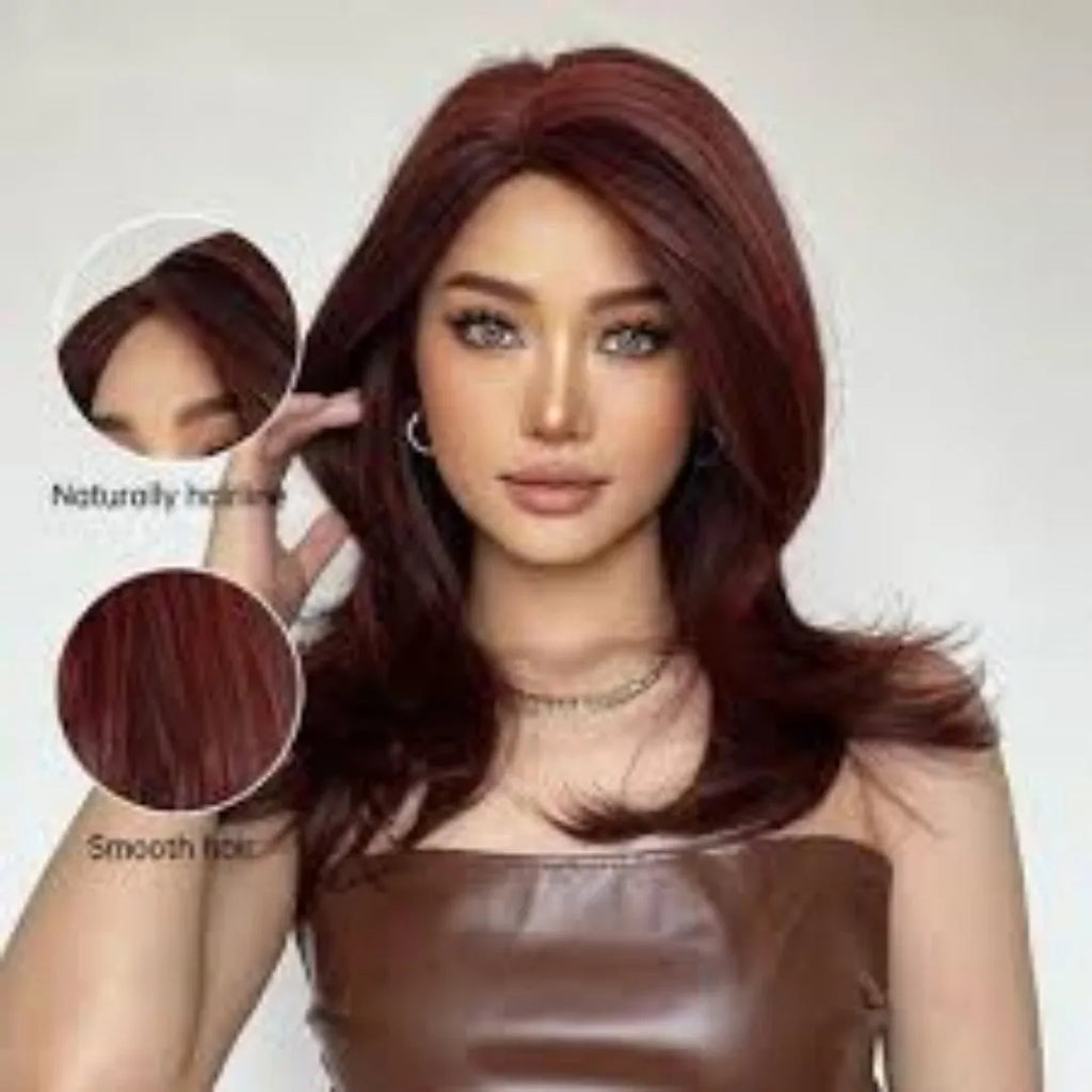 Mid-length curly synthetic wig with gradient colour and long bangs on a wig stand.