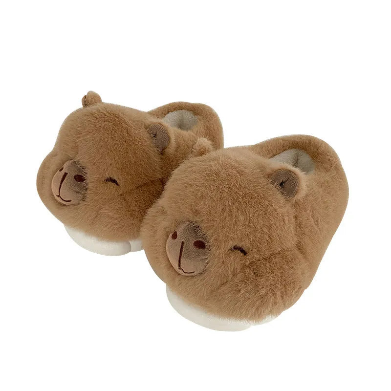 Light brown women's winter slippers with cotton plush upper and cartoon pattern.