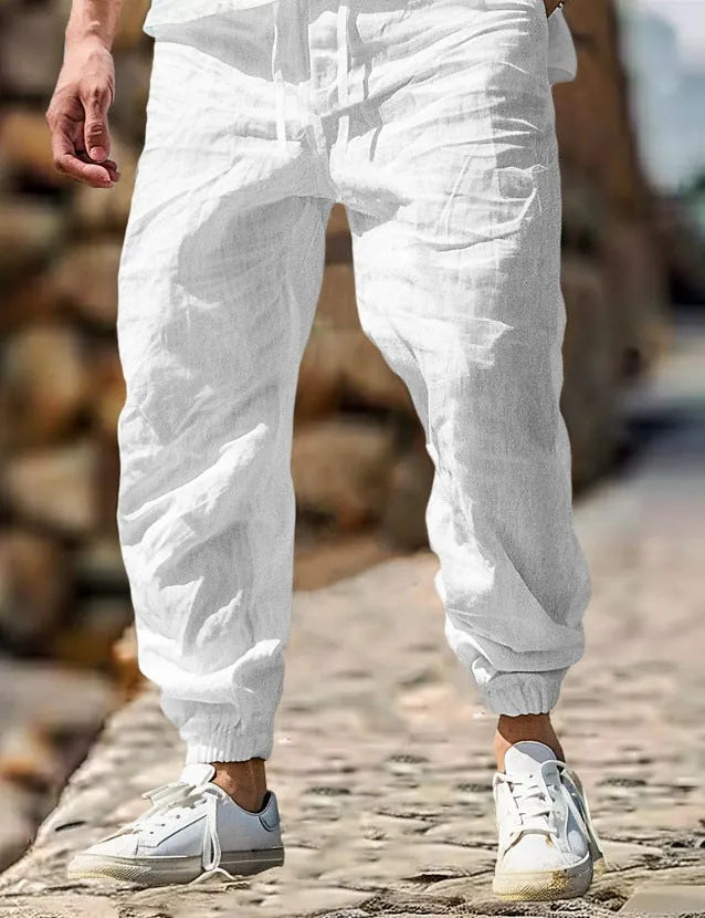 Men's straight-leg cotton trousers with elastic waistband in Army Green colour showing straight silhouette