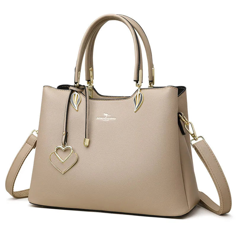 Women's black PU leather messenger bag with shoulder strap and sewing thread detailing