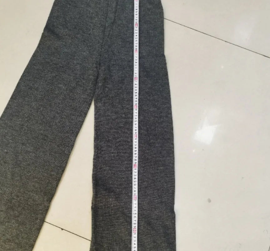 Women's acrylic suit set with side-slit sweater and matching trousers in solid colour
