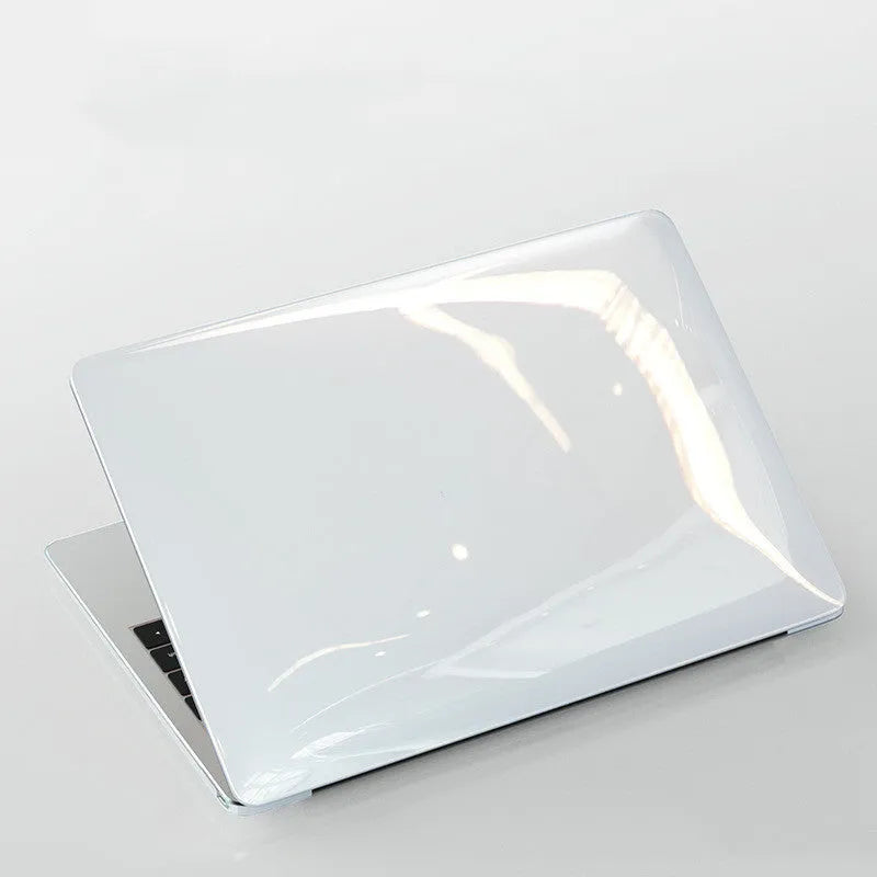 Hard transparent protective case for Apple MacBook Pro laptop showing port cutouts