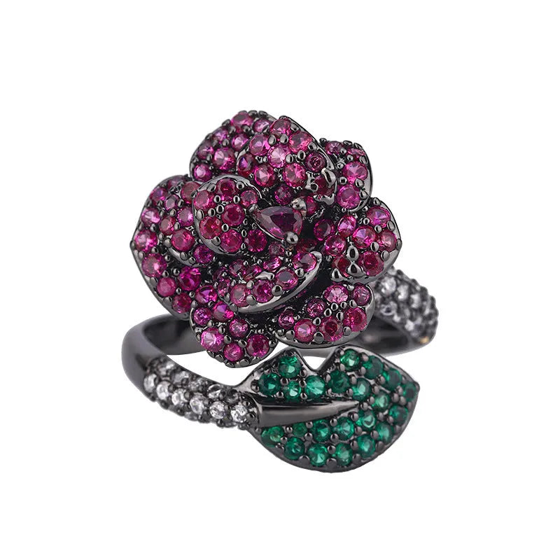 Black gold geometric flower ring with simulated red corundum centrepiece on copper base