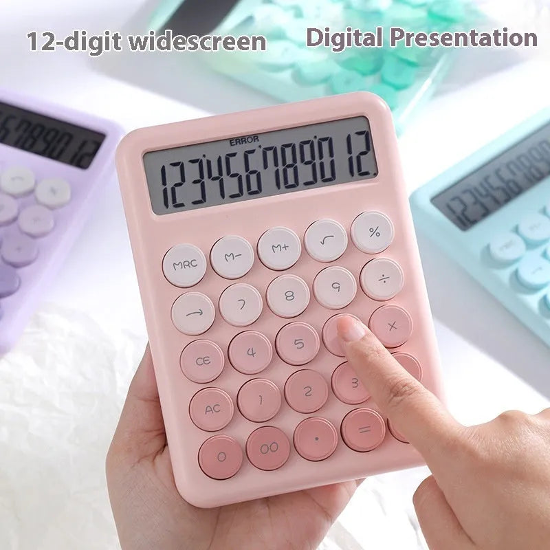 Gradient colour desk calculator in violet, cherry blossom pink, blue, or mint green on a desk.